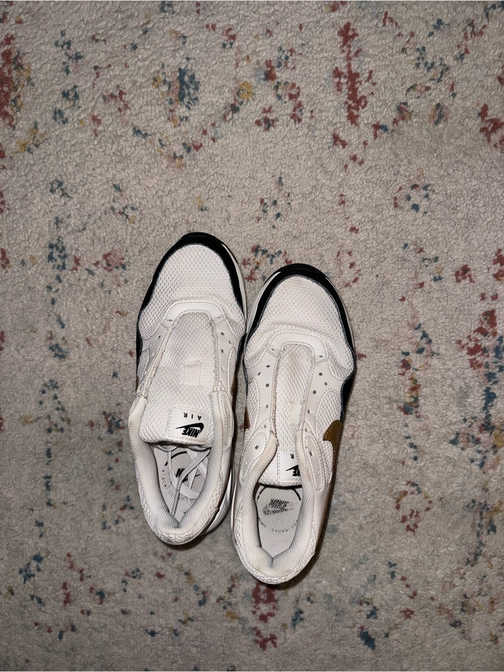 Nike White Sneakers with Black Trim and Gold Swoosh